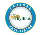 A round logo that says trained facilitator and health rhythms.